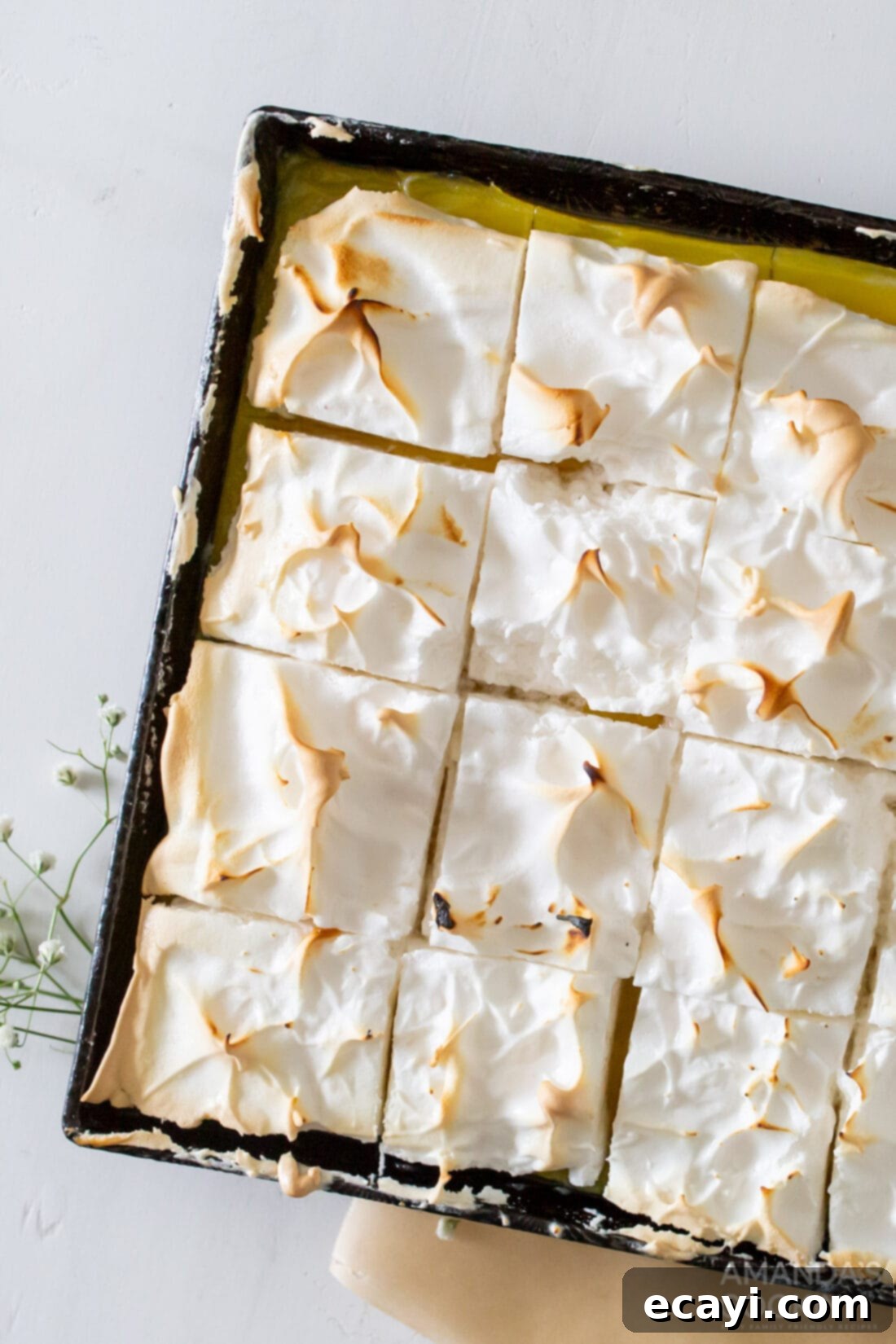 Tangy Lemon Meringue Pie Bars 3 Pan of Lemon Meringue Pie Bars cut into squares, showcasing the layers
