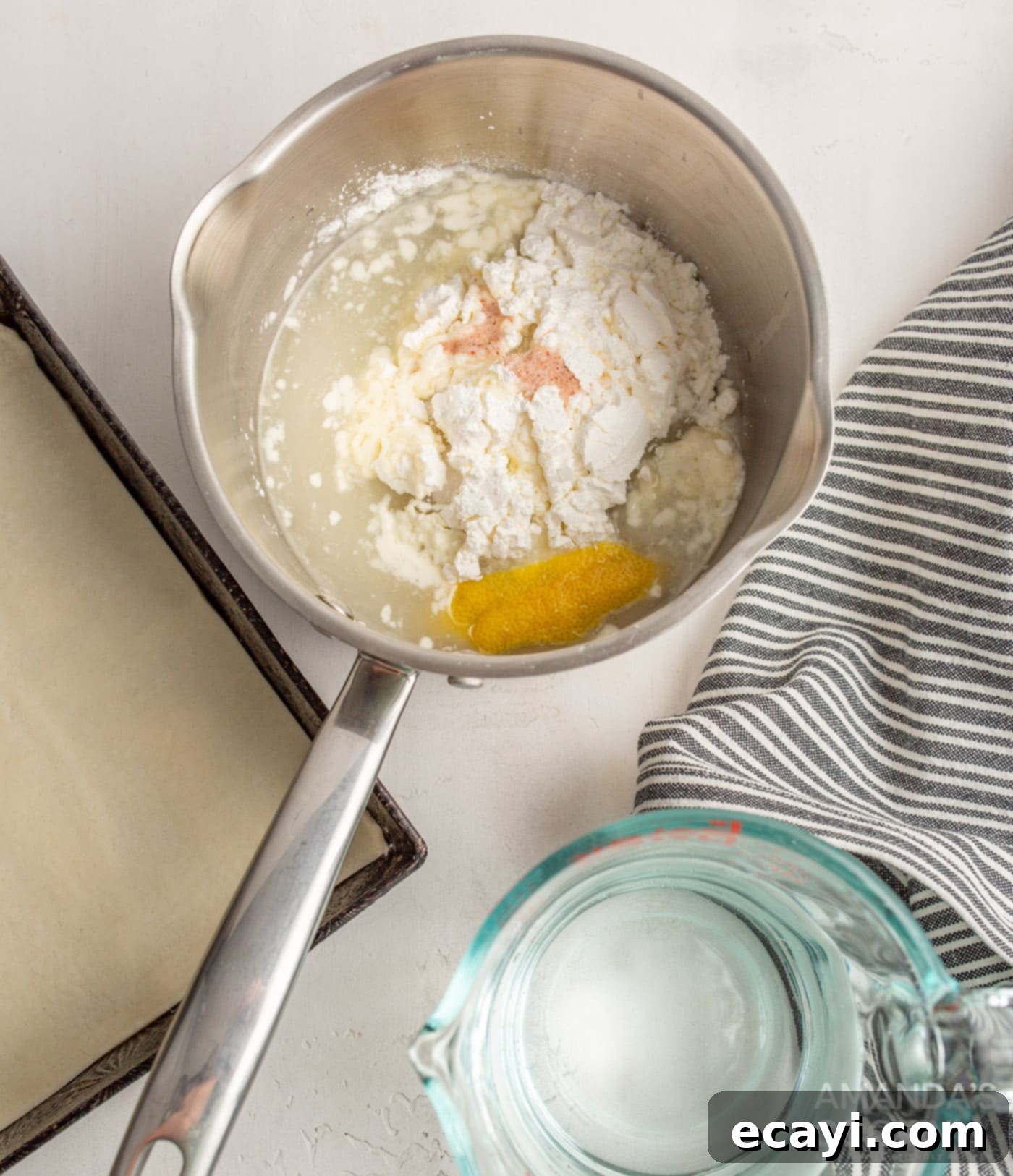 Tangy Lemon Meringue Pie Bars 5 Lemon curd ingredients in a saucepan, being whisked