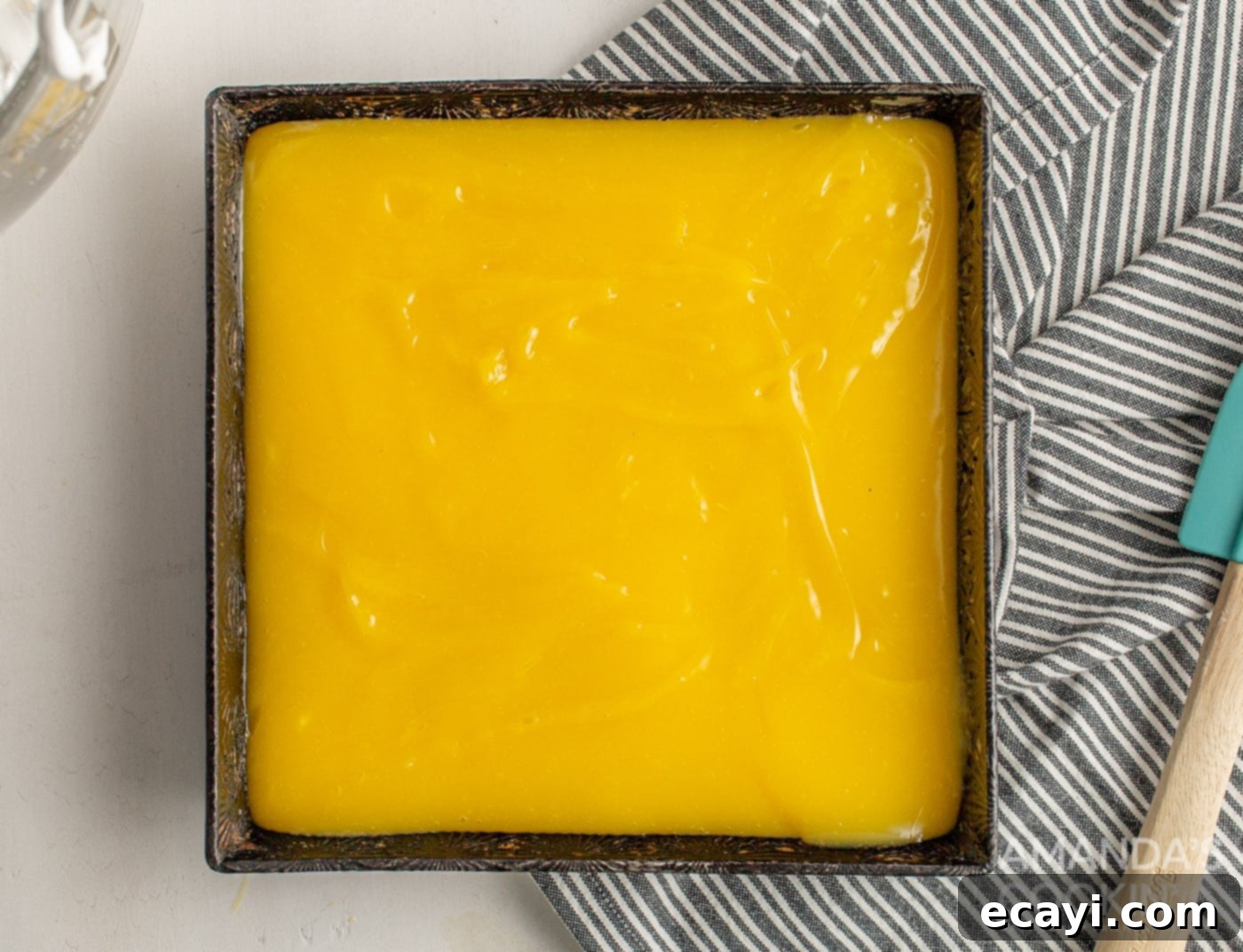Tangy Lemon Meringue Pie Bars 7 Lemon mixture poured on top of the crust in a baking pan