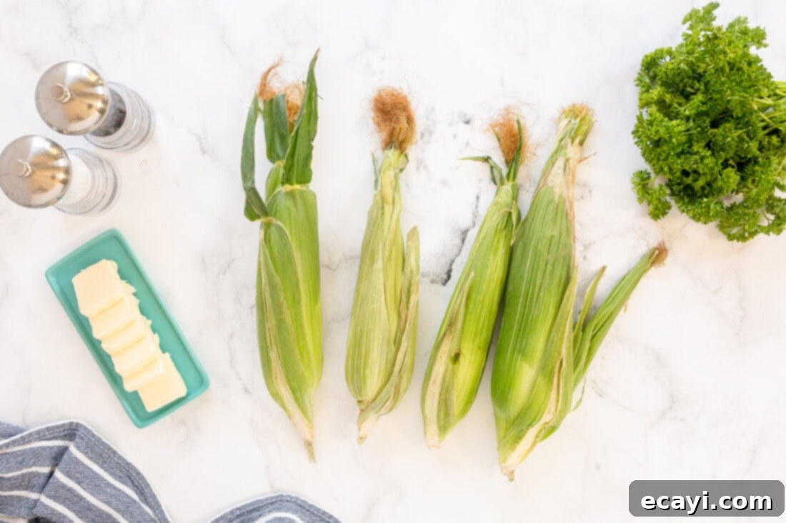 Golden Grilled Corn 4 Ingredients for Grilled Corn on the Cob, including fresh corn and butter