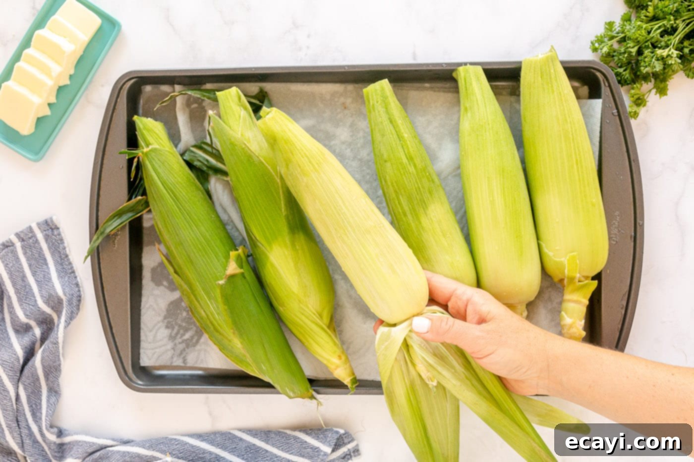 Golden Grilled Corn 7 Removing outer husks on corn before grilling
