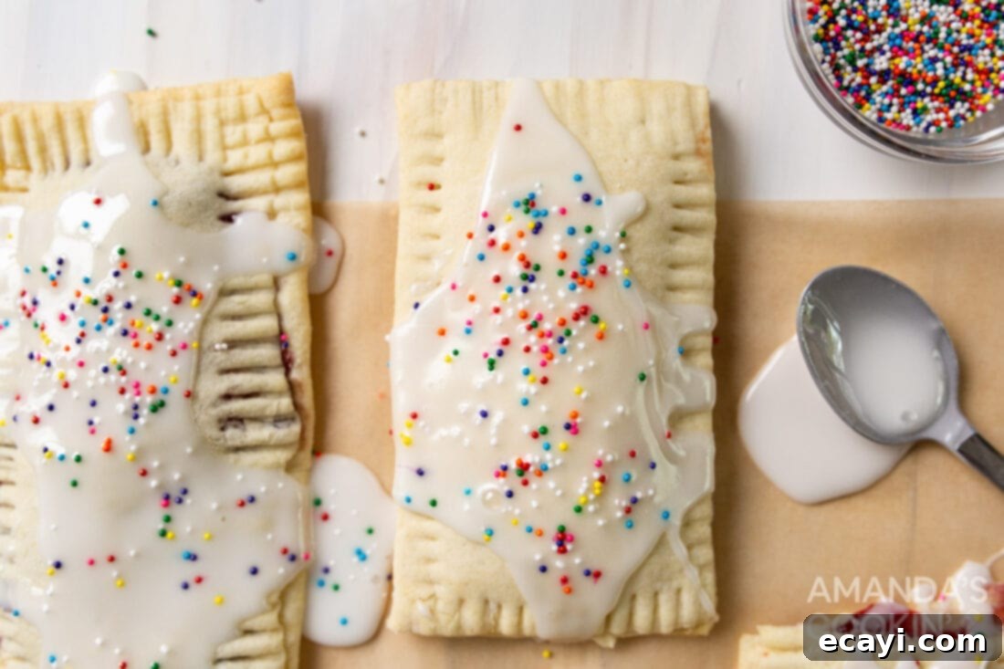 Whip Up Your Own Pop Tarts 12 A wider shot of a plate of homemade pop tarts, beautifully glazed and garnished with sprinkles