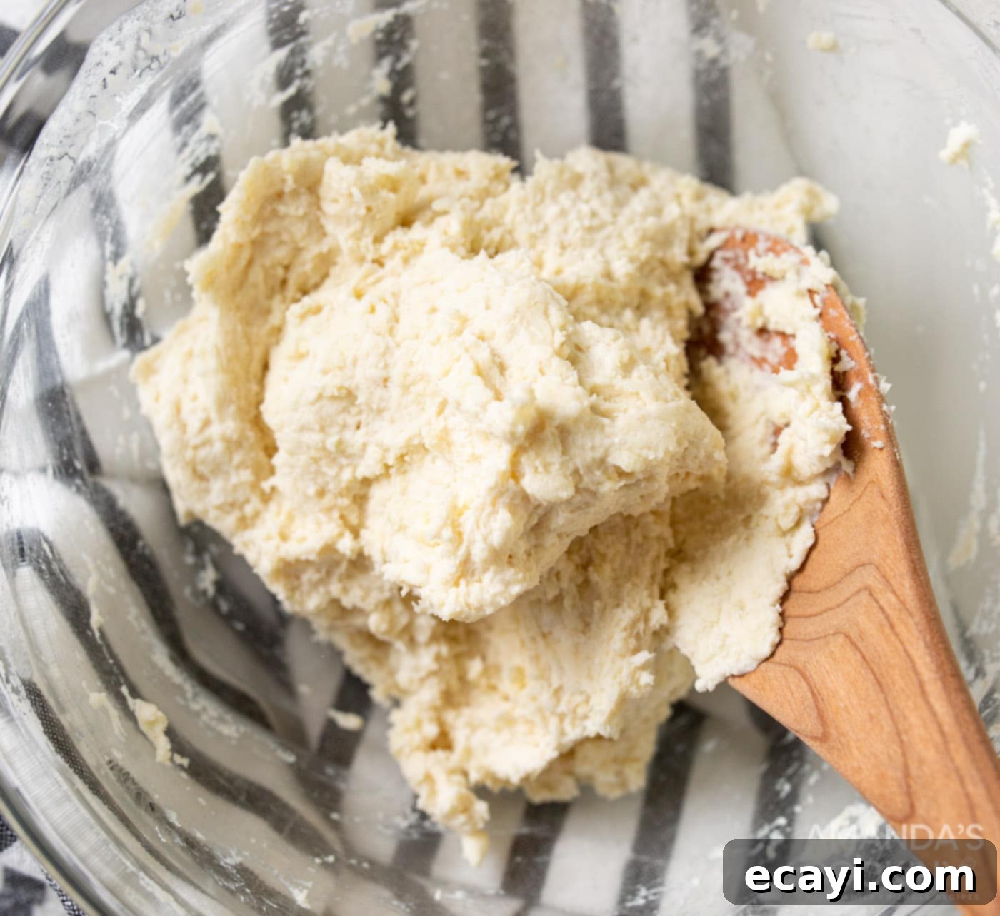 Whip Up Your Own Pop Tarts 5 Pie dough in a bowl with a wooden spoon, indicating it's ready for preparation