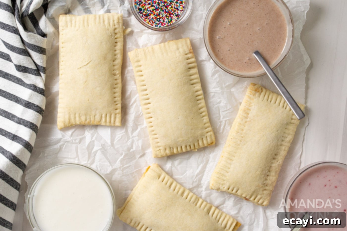 Whip Up Your Own Pop Tarts 9 Baked pop tarts cooling on a rack, with a bowl of homemade glaze on the side ready to be applied