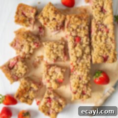 Strawberry Rhubarb Crumbly Bars 11 Strawberry Rhubarb Crumble Bars cooling on parchment paper