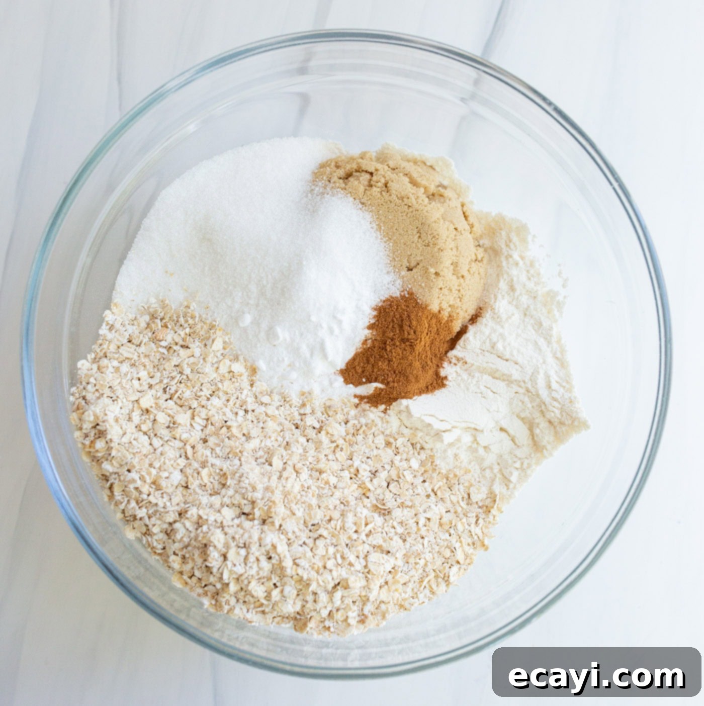 Strawberry Rhubarb Crumbly Bars 5 Crumble topping ingredients being mixed in a bowl until crumbly and wet looking.