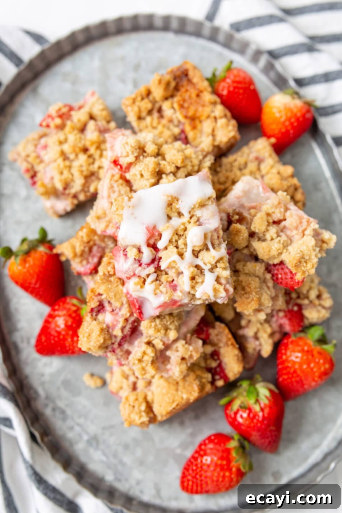 Strawberry Rhubarb Crumbly Bars 10 A large serving platter piled high with freshly baked Strawberry Rhubarb Crumble Bars, ready for a gathering.