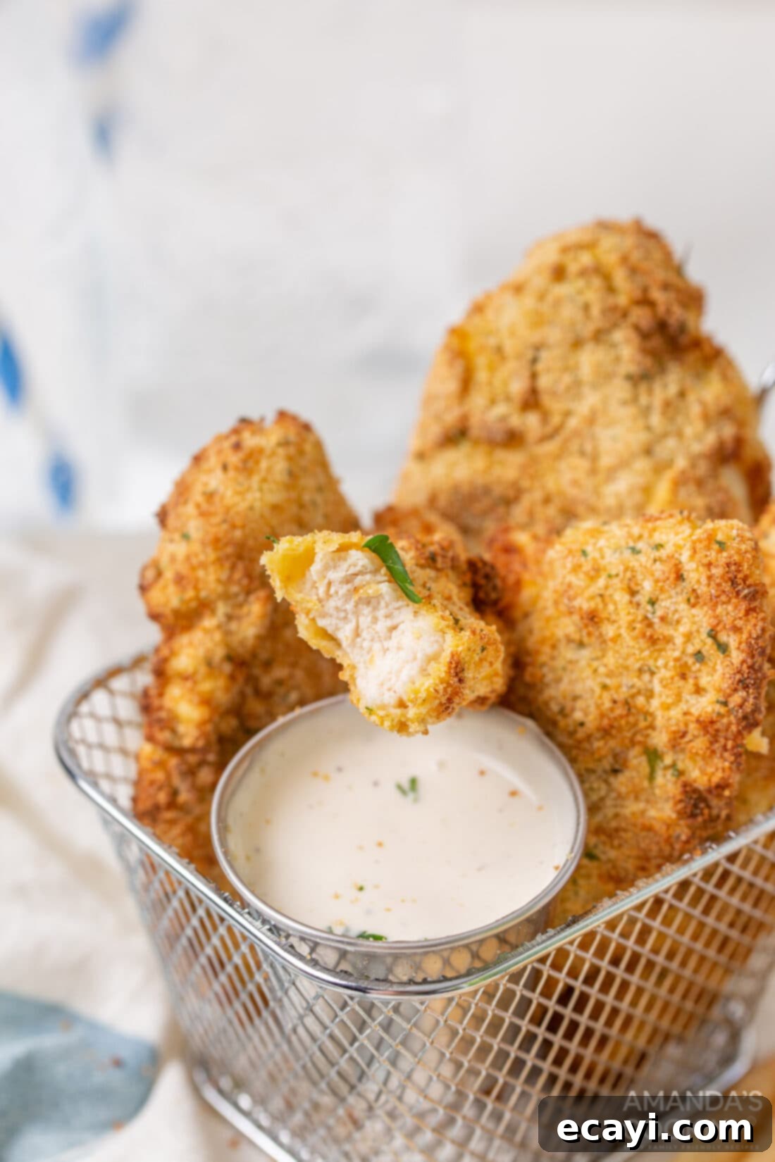Crispy Air Fryer Chicken Tenders 9 air fryer chicken tenders in basket with ranch