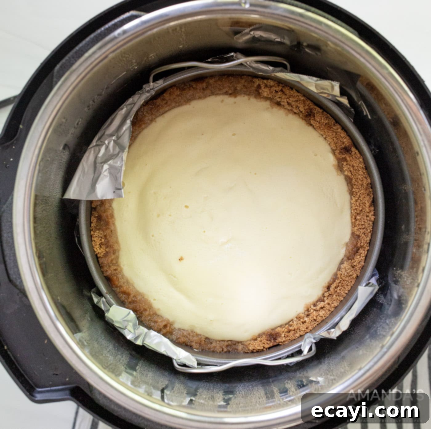 Silky Smooth Instant Pot Cheesecake 11 baked cheesecake inside an instant pot