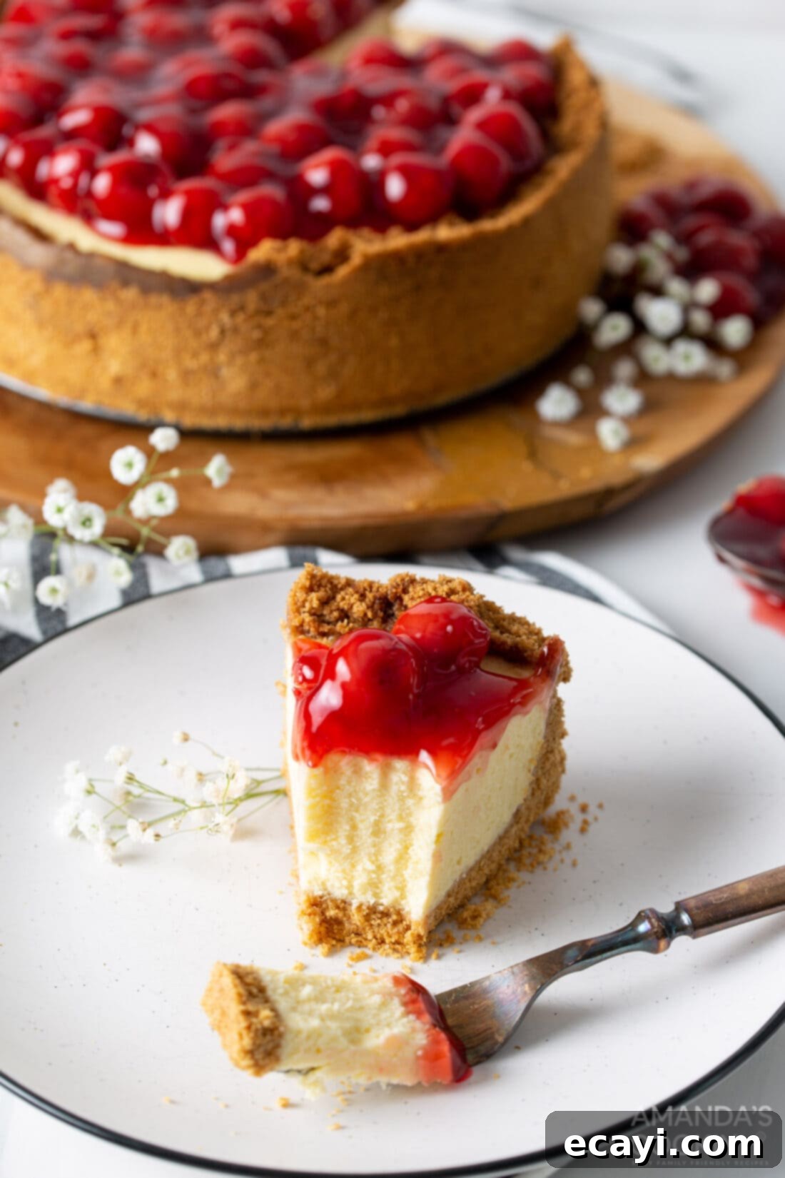 Silky Smooth Instant Pot Cheesecake 3 slice of instant pot cherry cheesecake with fork slice removed