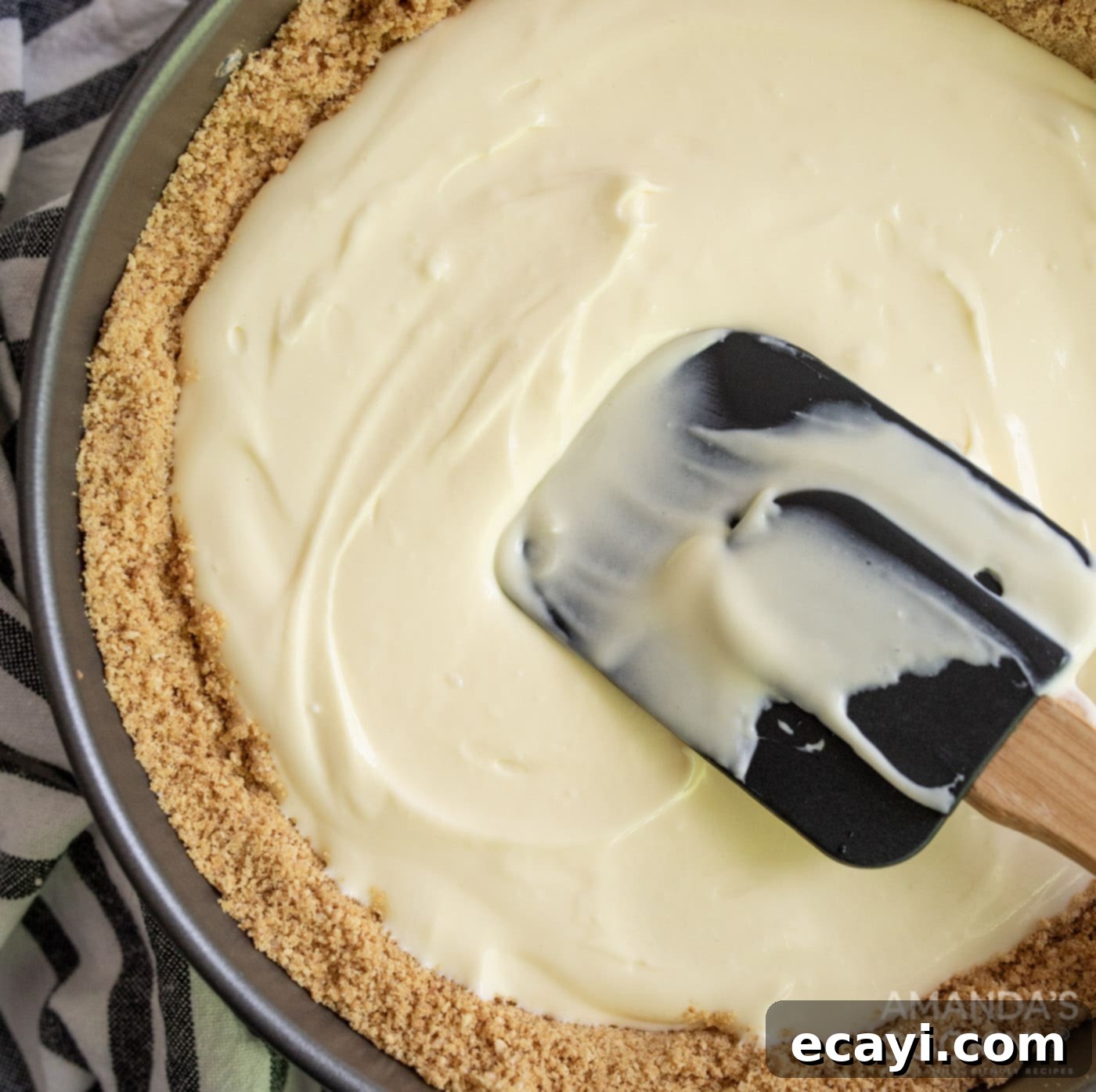 Silky Smooth Instant Pot Cheesecake 9 cream cheese mixture spread with a rubber spatula