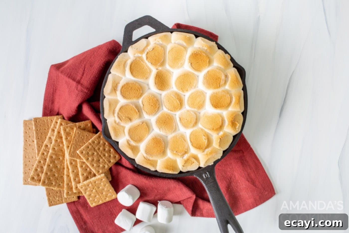 Gooey S'mores Skillet 7 Perfectly toasted S'mores Dip in a cast-iron skillet, with golden-brown marshmallows and melted chocolate beneath.