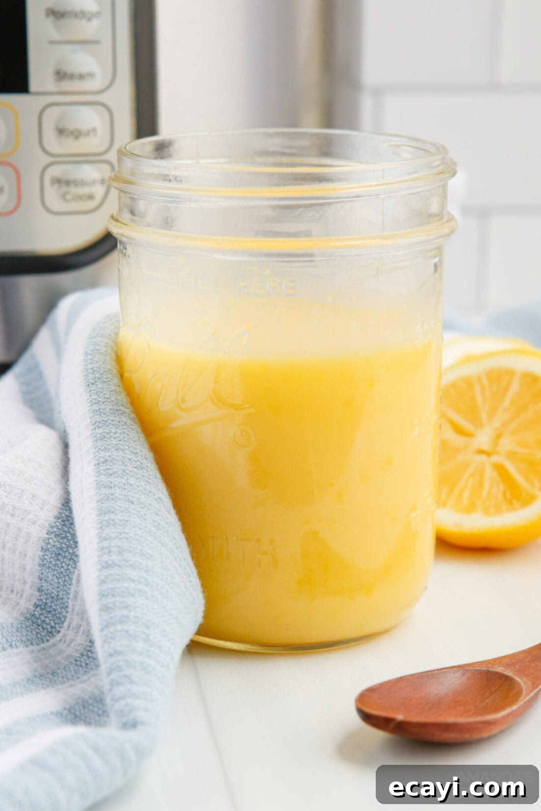 Effortless Instant Pot Lemon Curd 2 jar of lemon curd, showcasing its bright yellow color and smooth texture