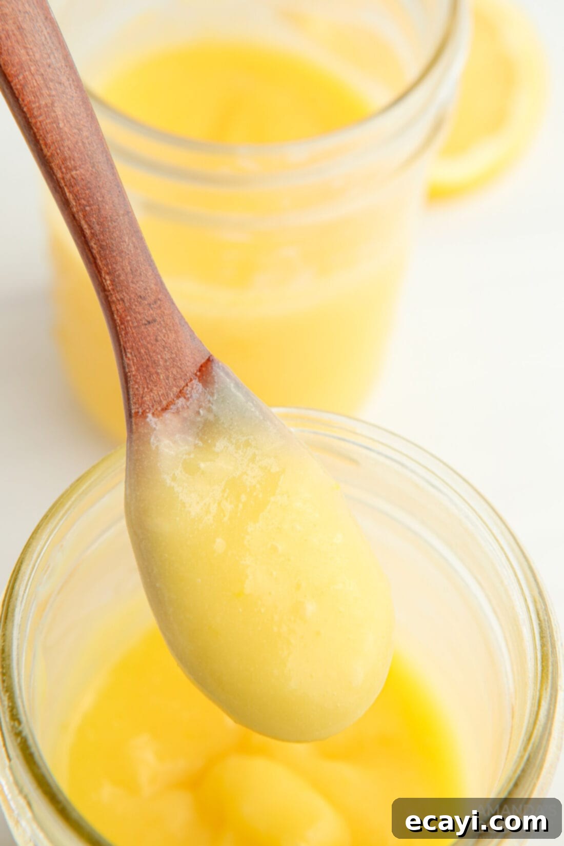 Effortless Instant Pot Lemon Curd 3 spoonful of vibrant homemade lemon curd