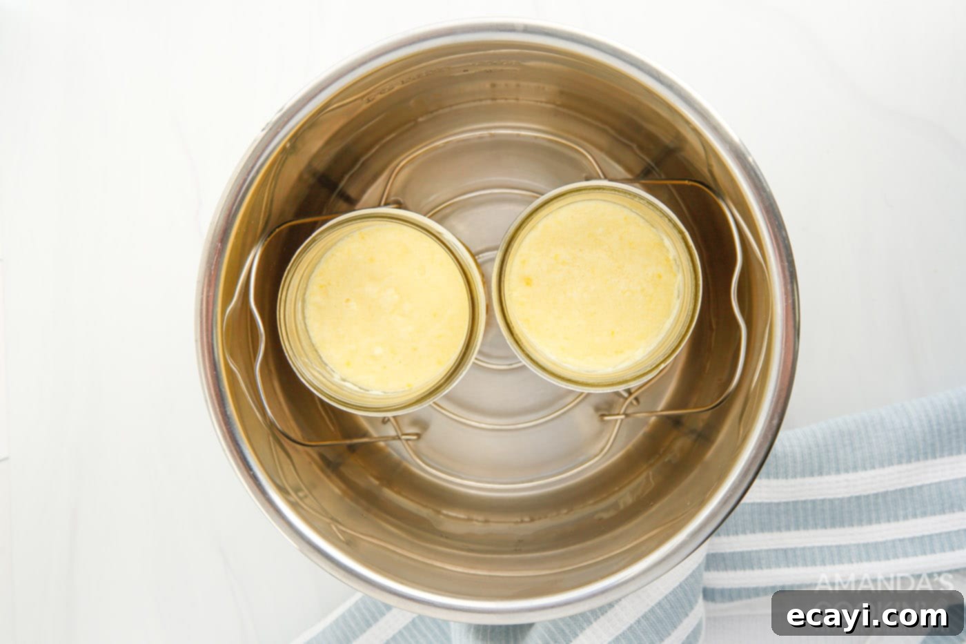 Effortless Instant Pot Lemon Curd 6 lemon curd mixture poured into mason jars, ready for the instant pot
