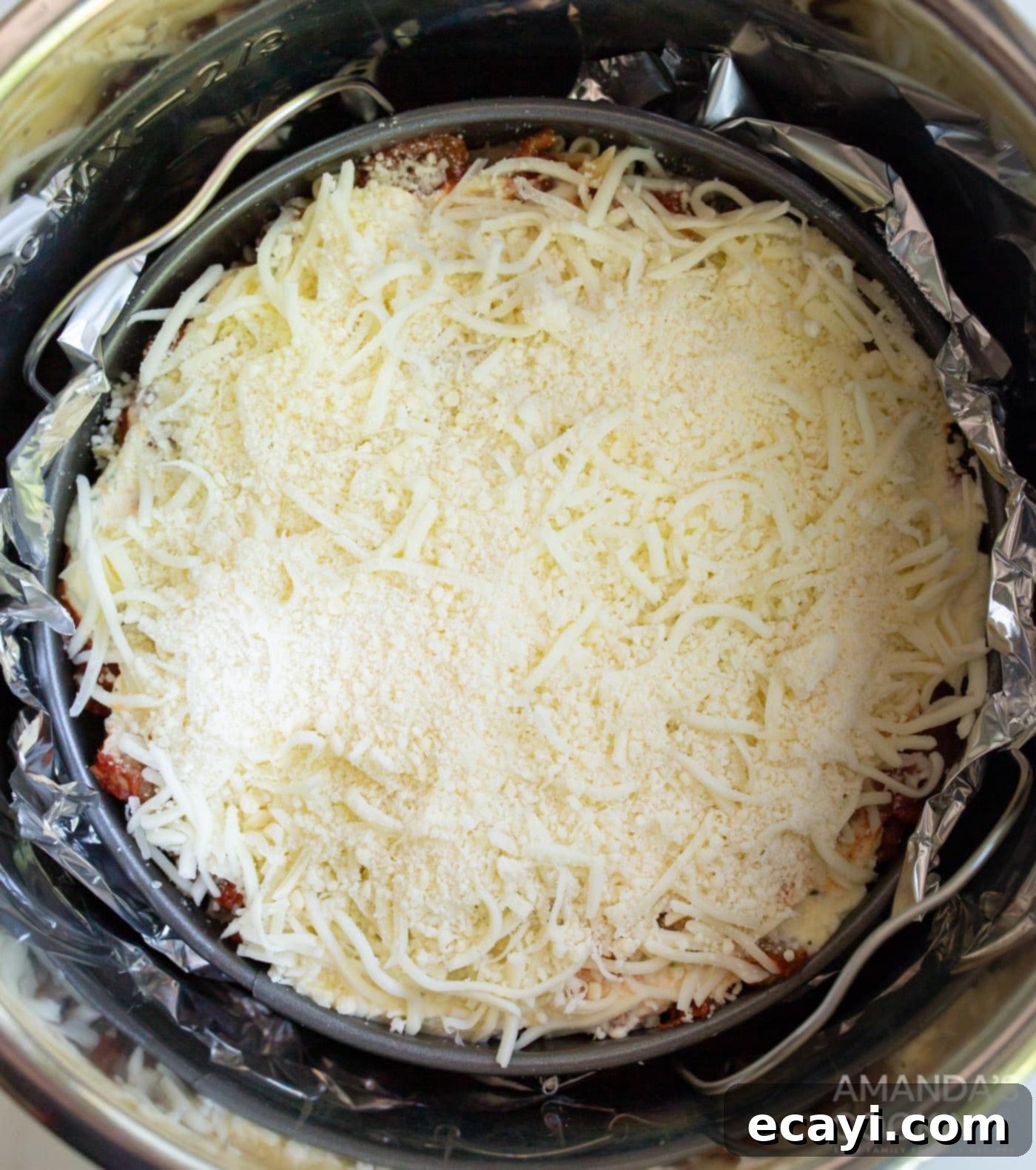 Quick Instant Pot Lasagna 11 Springform pan wrapped in aluminum foil, placed on a trivet inside the Instant Pot.