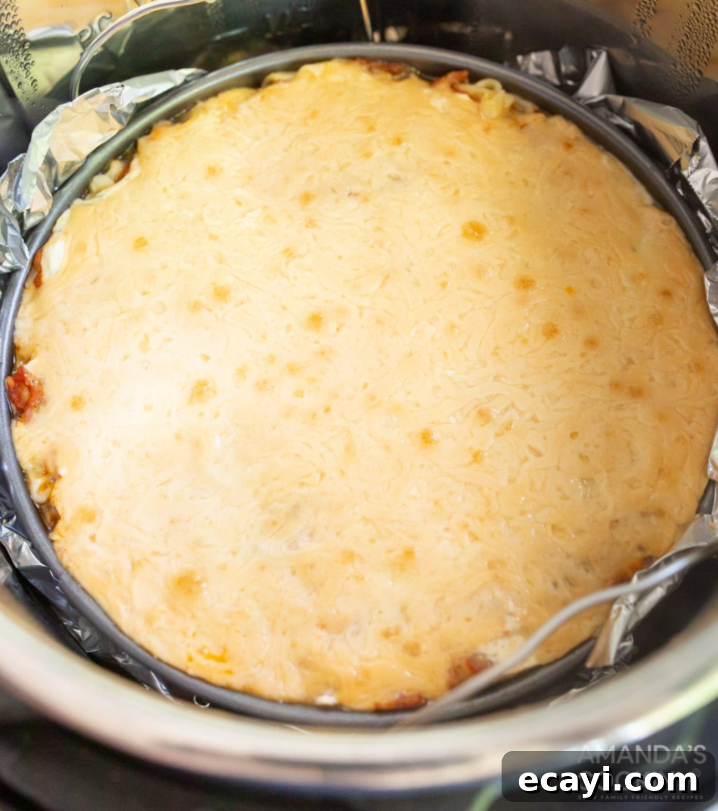 Quick Instant Pot Lasagna 12 Baked lasagna, golden brown and bubbly, in the Instant Pot after broiling.
