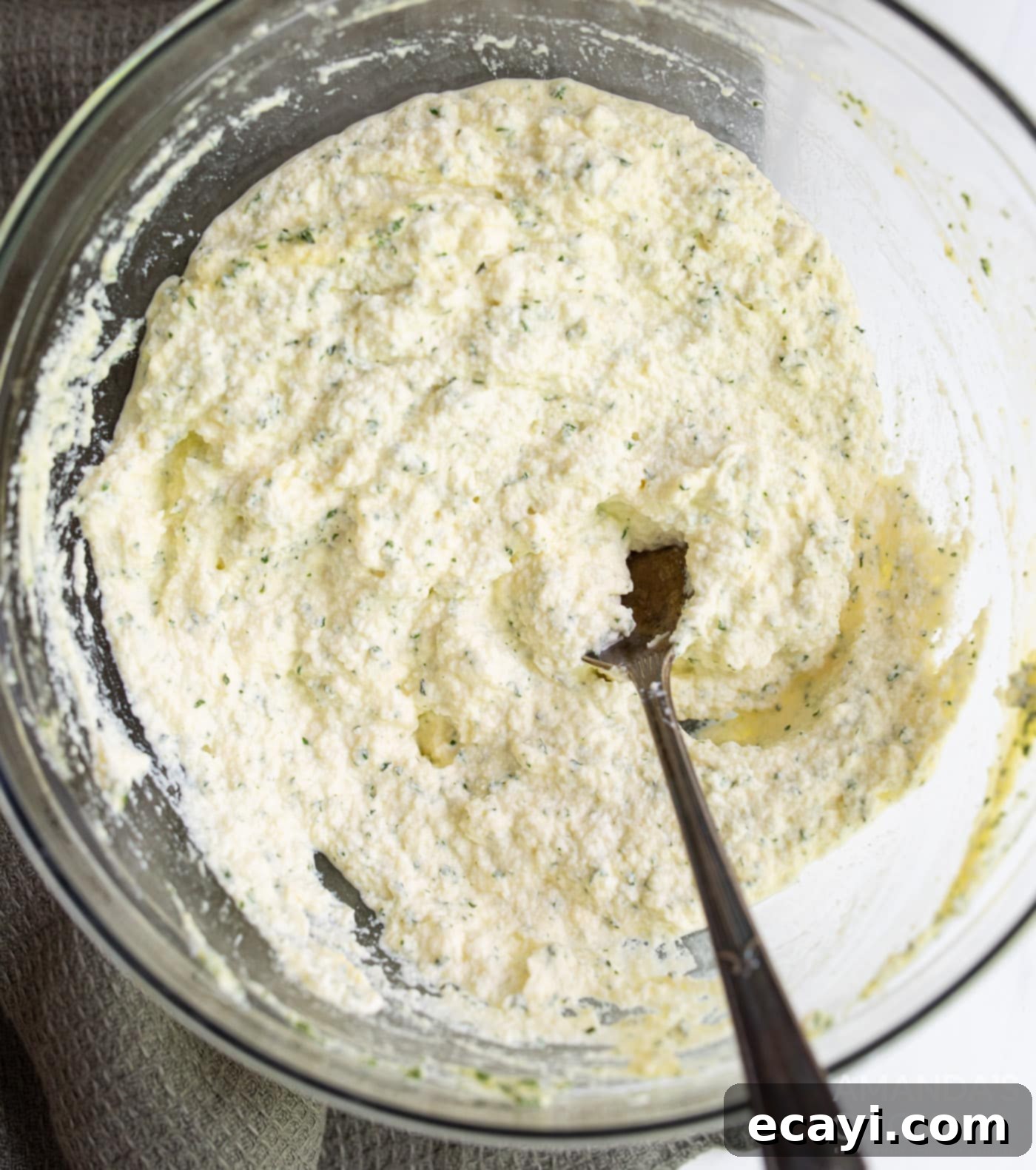Quick Instant Pot Lasagna 6 Ricotta cheese, egg, and parsley blended in a bowl for the lasagna filling