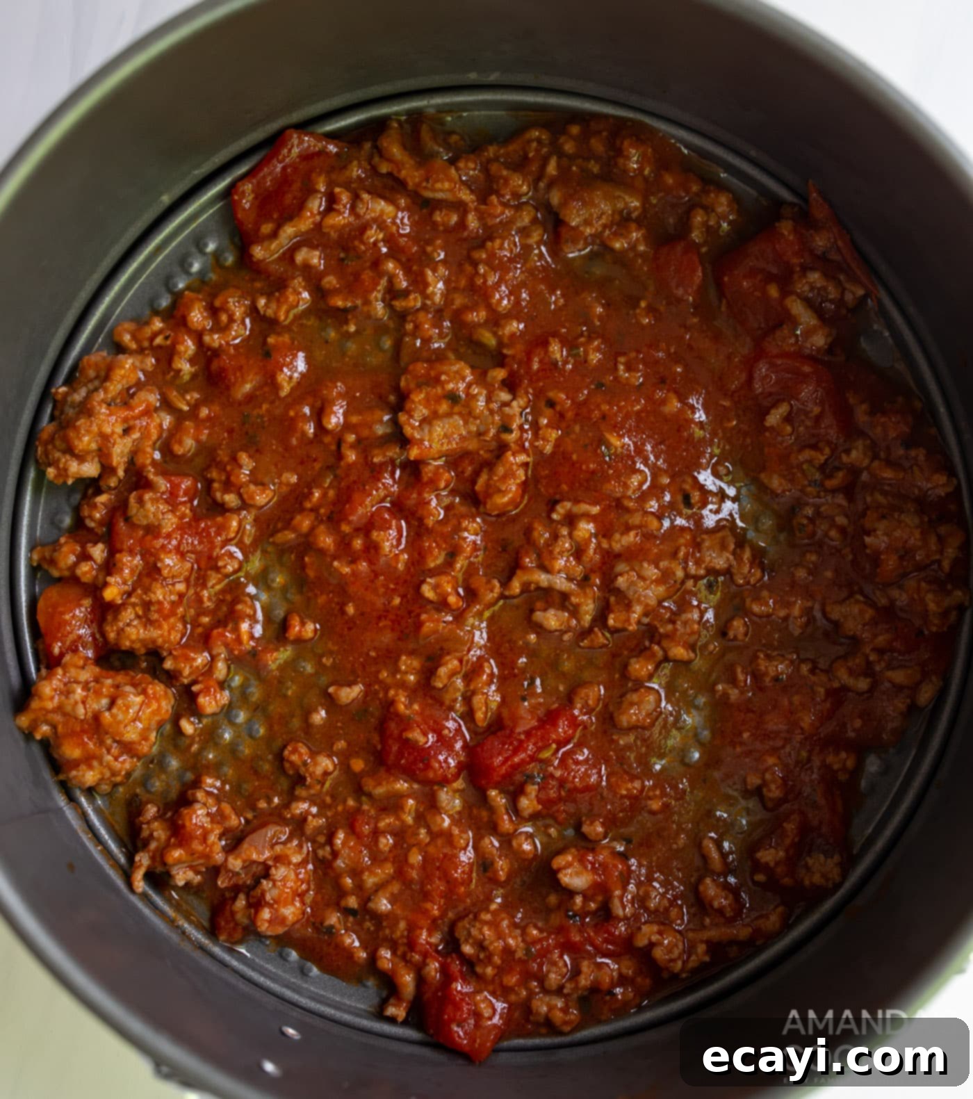 Quick Instant Pot Lasagna 7 First layer of meat sauce in a springform pan.