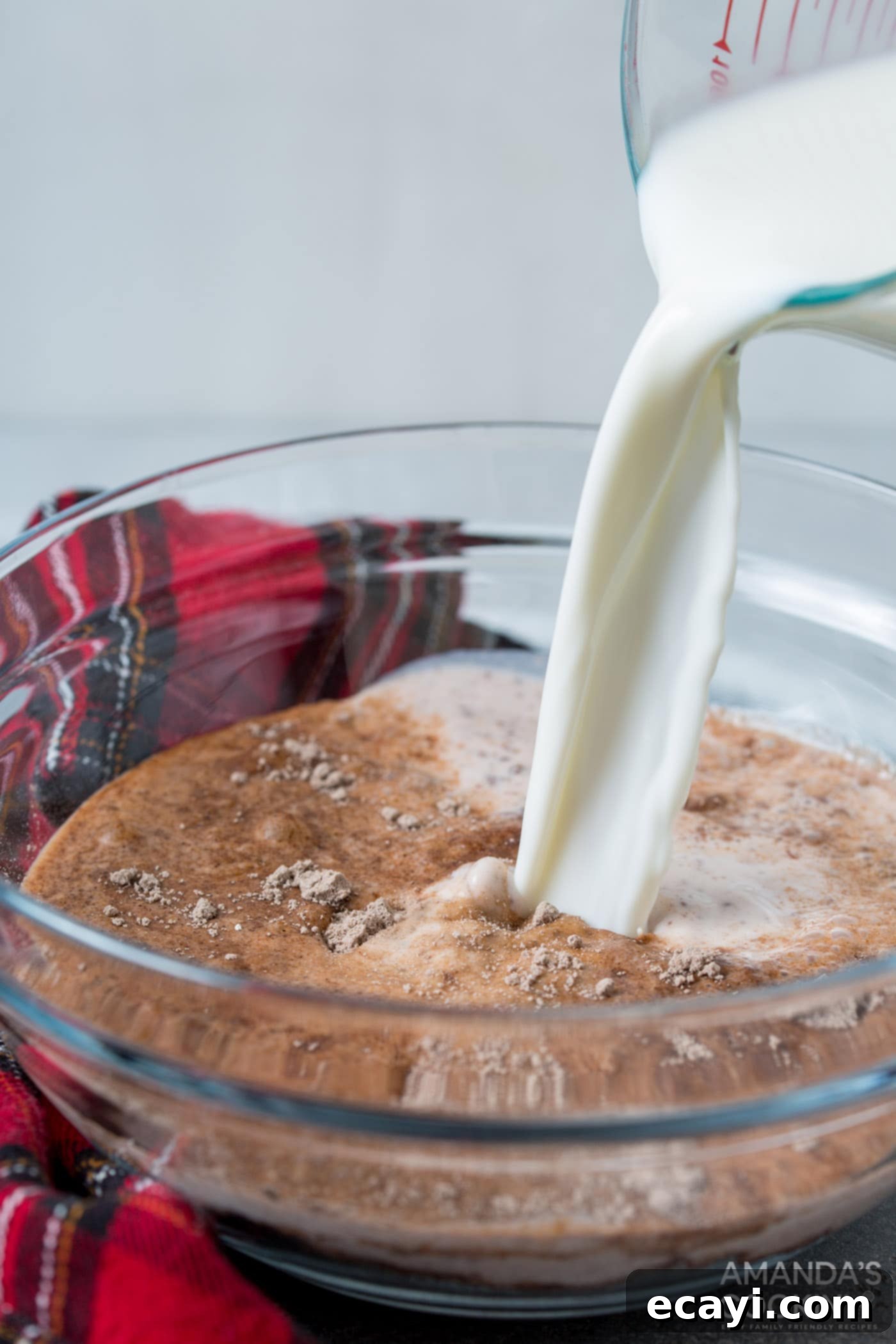 Frosty Smores 5 pouring milk into chocolate pudding mix