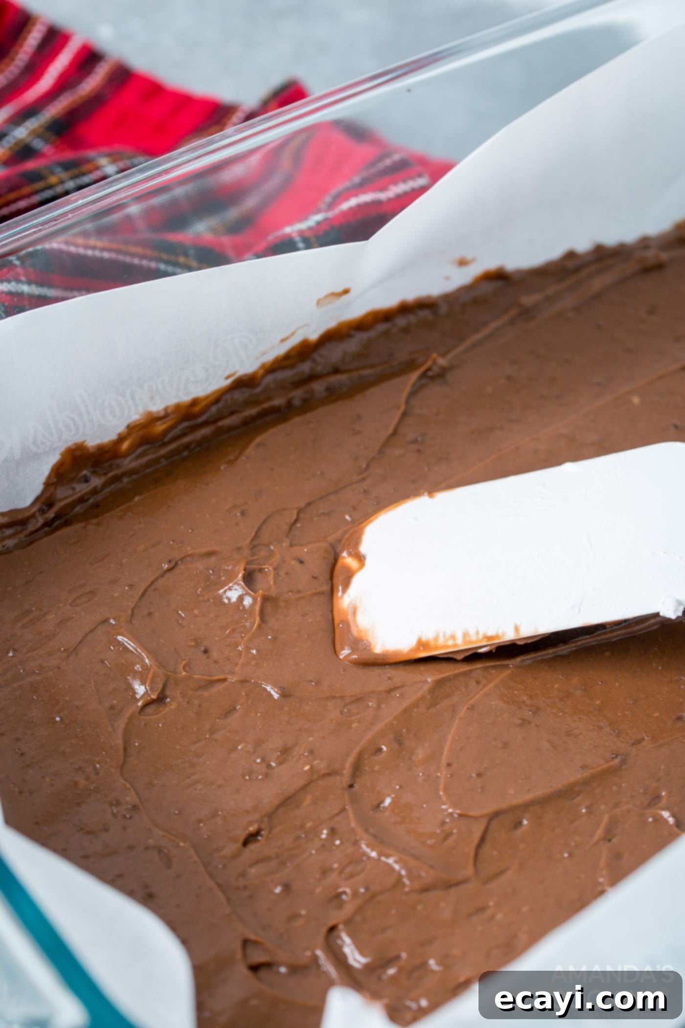 Frosty Smores 6 rubber spatula smoothing chocolate pudding into pan