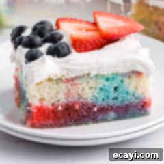 Patriotic Red, White and Blue Poke Cake 12 A festive Red, White, and Blue Poke Cake with fresh berries.