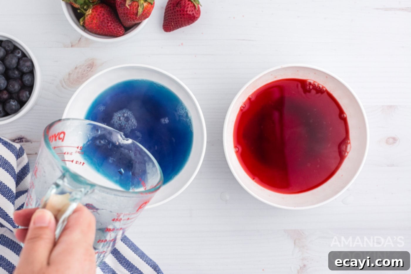 Patriotic Red, White and Blue Poke Cake 5 Adding water to separate bowls of blue and red jello mix, preparing for infusion.