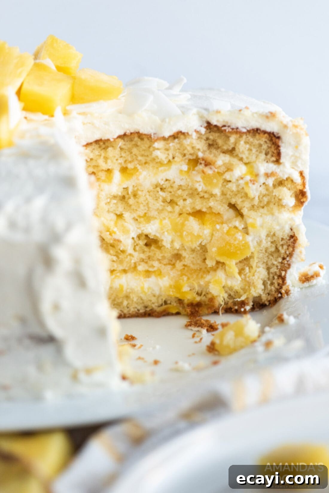 Golden Pineapple Bliss 11 A delicious slice of Pineapple Cake, showcasing its beautiful layers of cake and creamy filling.