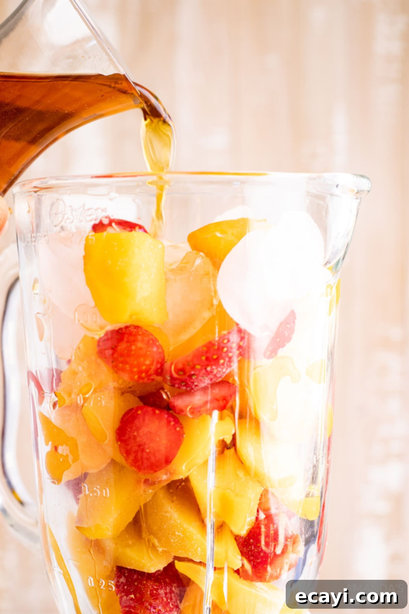 Island Vibes Rum Slush 5 Pouring dark rum into a blender filled with frozen fruit (peach, mango, strawberry) and ice for the tropical slush base.