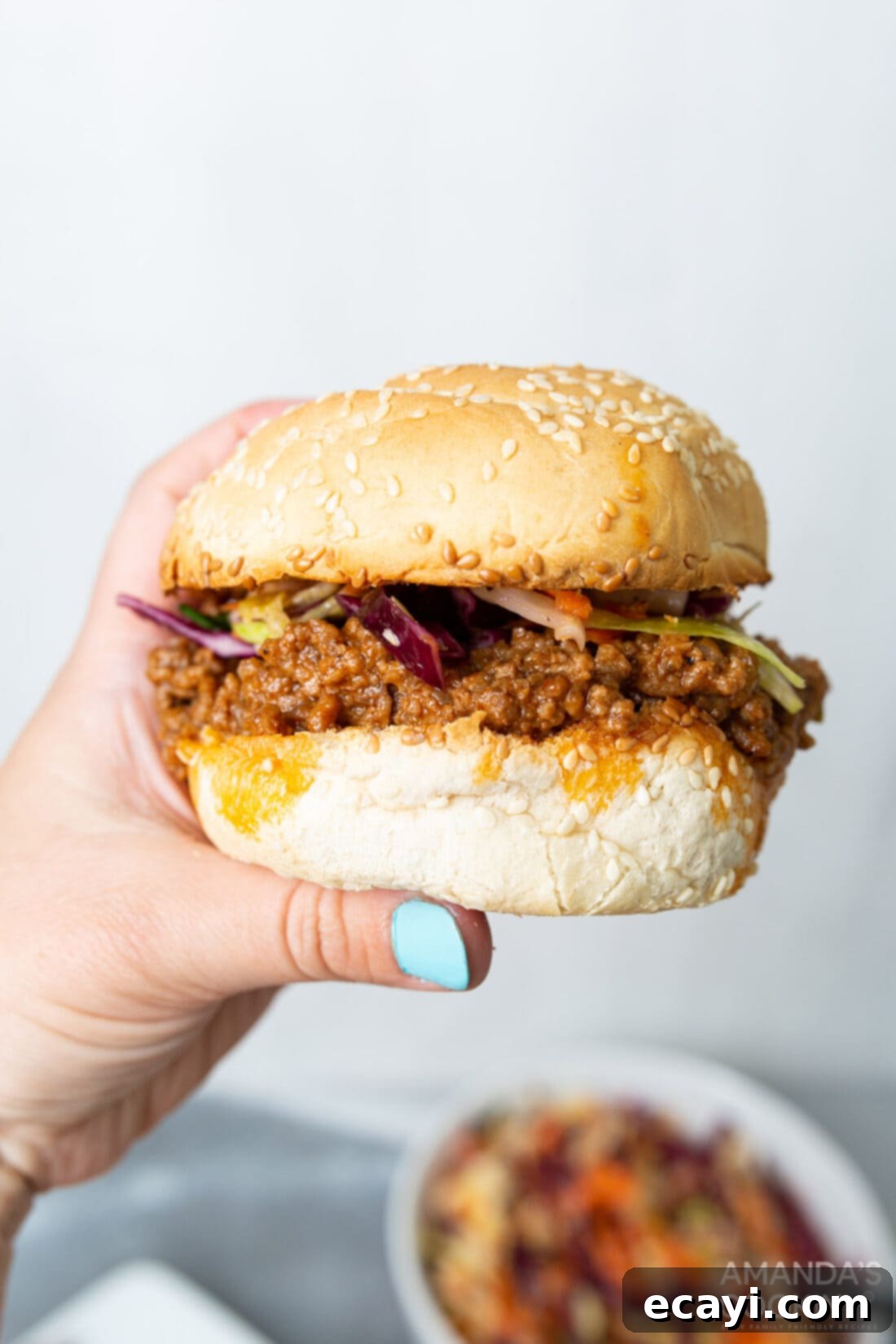 Instant Pot Sloppy Joes 3 holding a sloppy joe sandwich