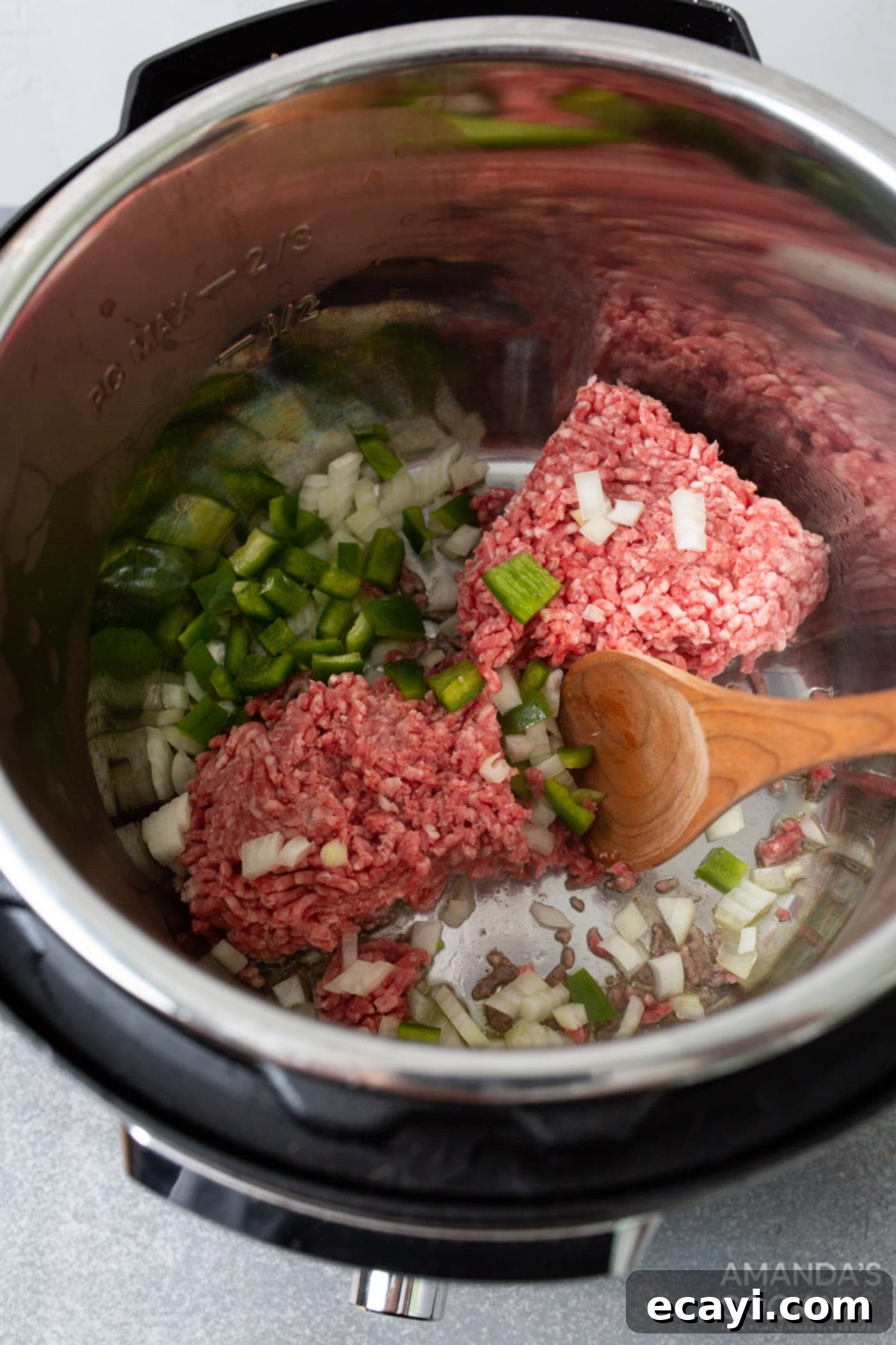 Instant Pot Sloppy Joes 5 browning ground beef, green pepper, and onion in the instant pot