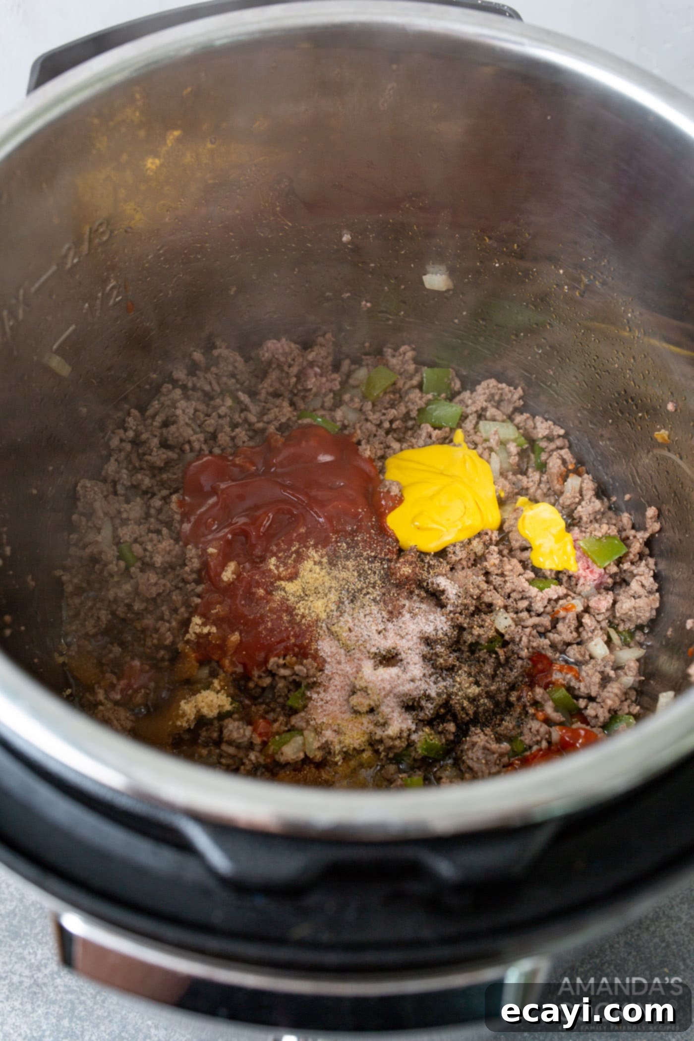 Instant Pot Sloppy Joes 6 stir in seasonings and sauce ingredients with ground beef in the instant pot