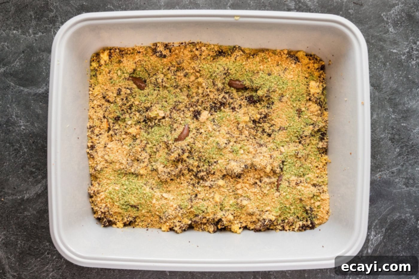 Litterally Delicious 12 green tined cookie crumbles on top of kitty litter cake