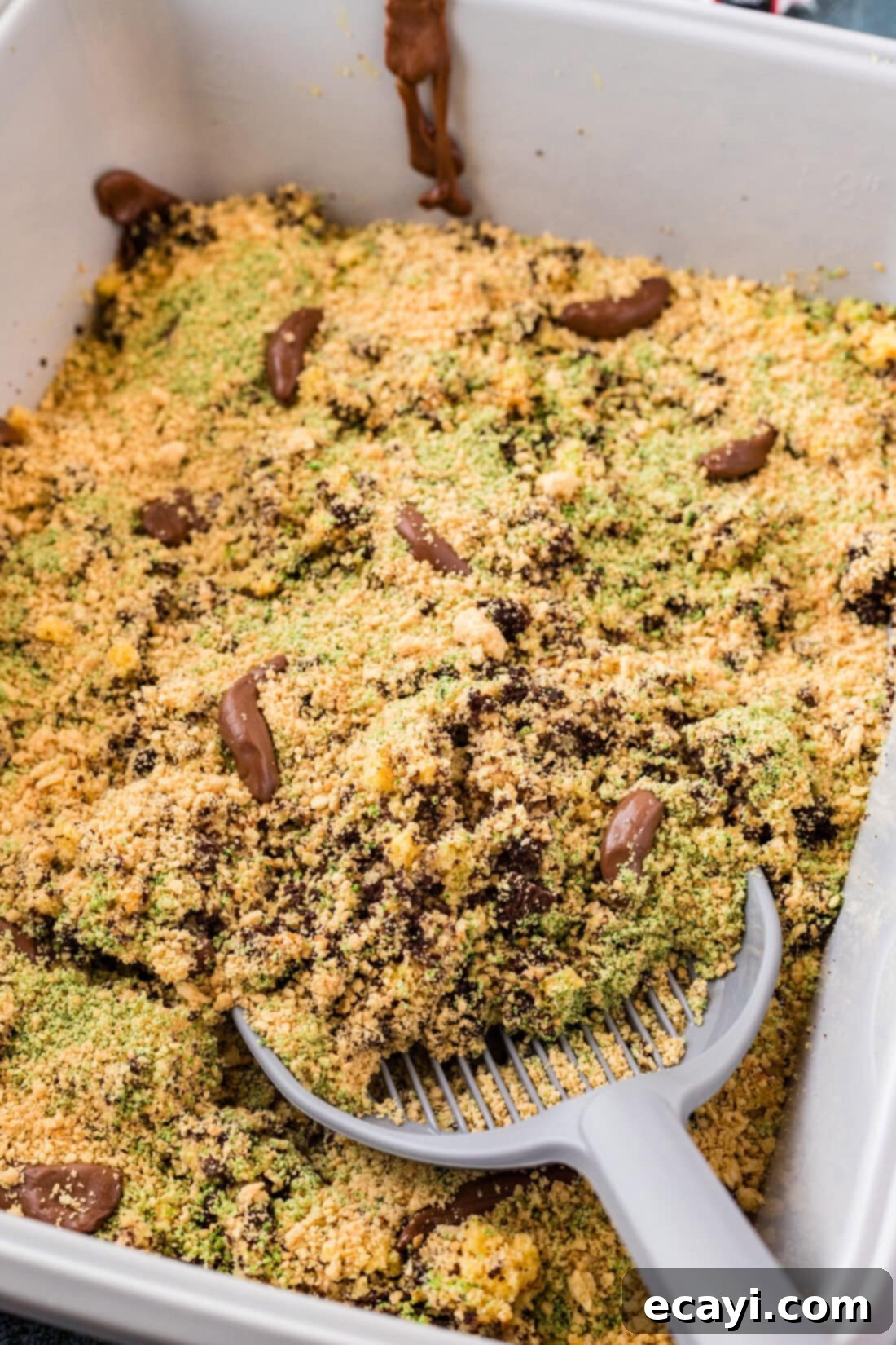 Litterally Delicious 3 Close up photo of a litter scoop in a Kitty Litter Cake