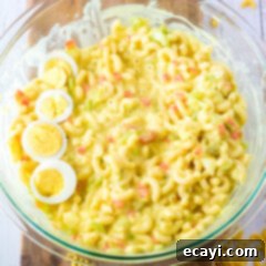 Creamy Amish Macaroni Perfection 7 Amish Macaroni Salad in a serving bowl, ready to be enjoyed.