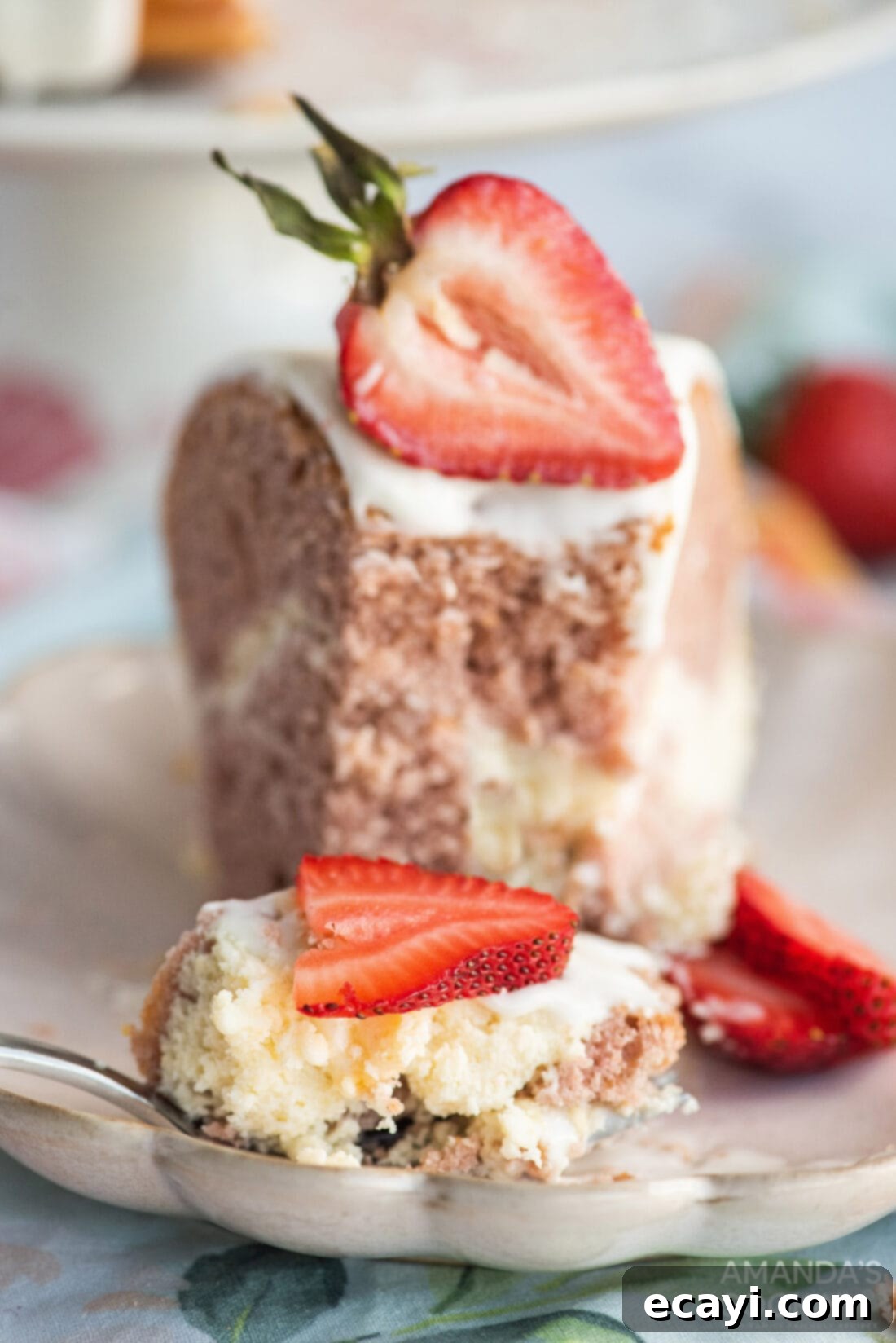 Summer Strawberry Bundt Delight 11 a fork taking a bite of strawberry bundt cake