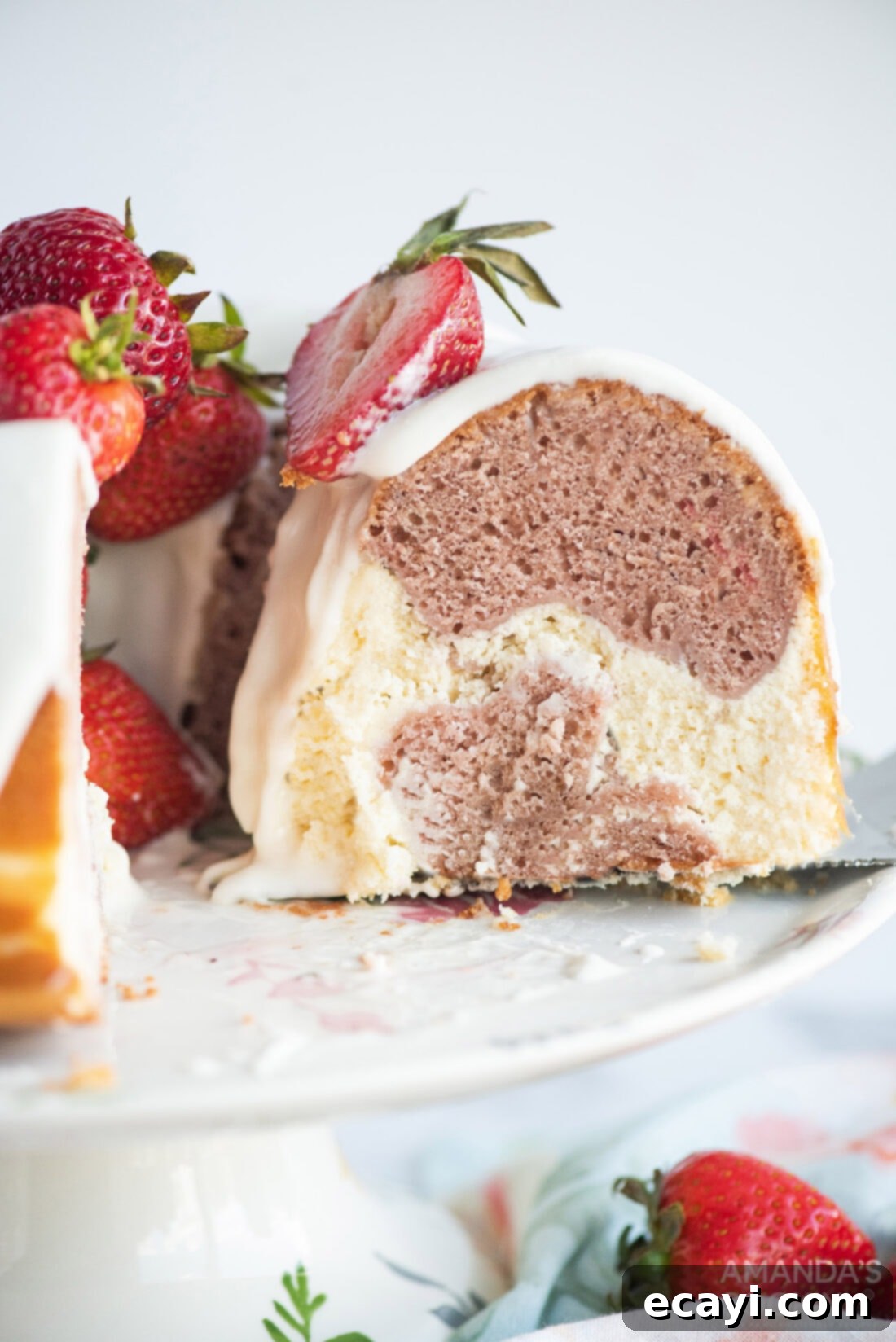 Summer Strawberry Bundt Delight 3 a perfect slice of strawberry bundt cake revealing the cheesecake swirl