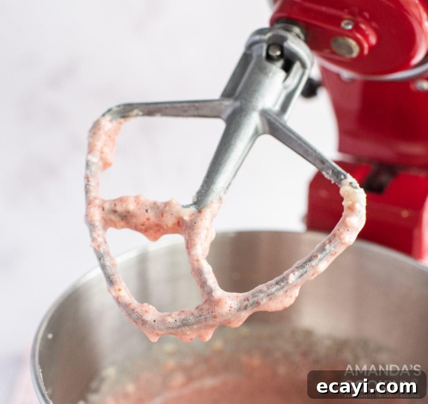 Summer Strawberry Bundt Delight 7 strawberry cake batter on a mixer paddle