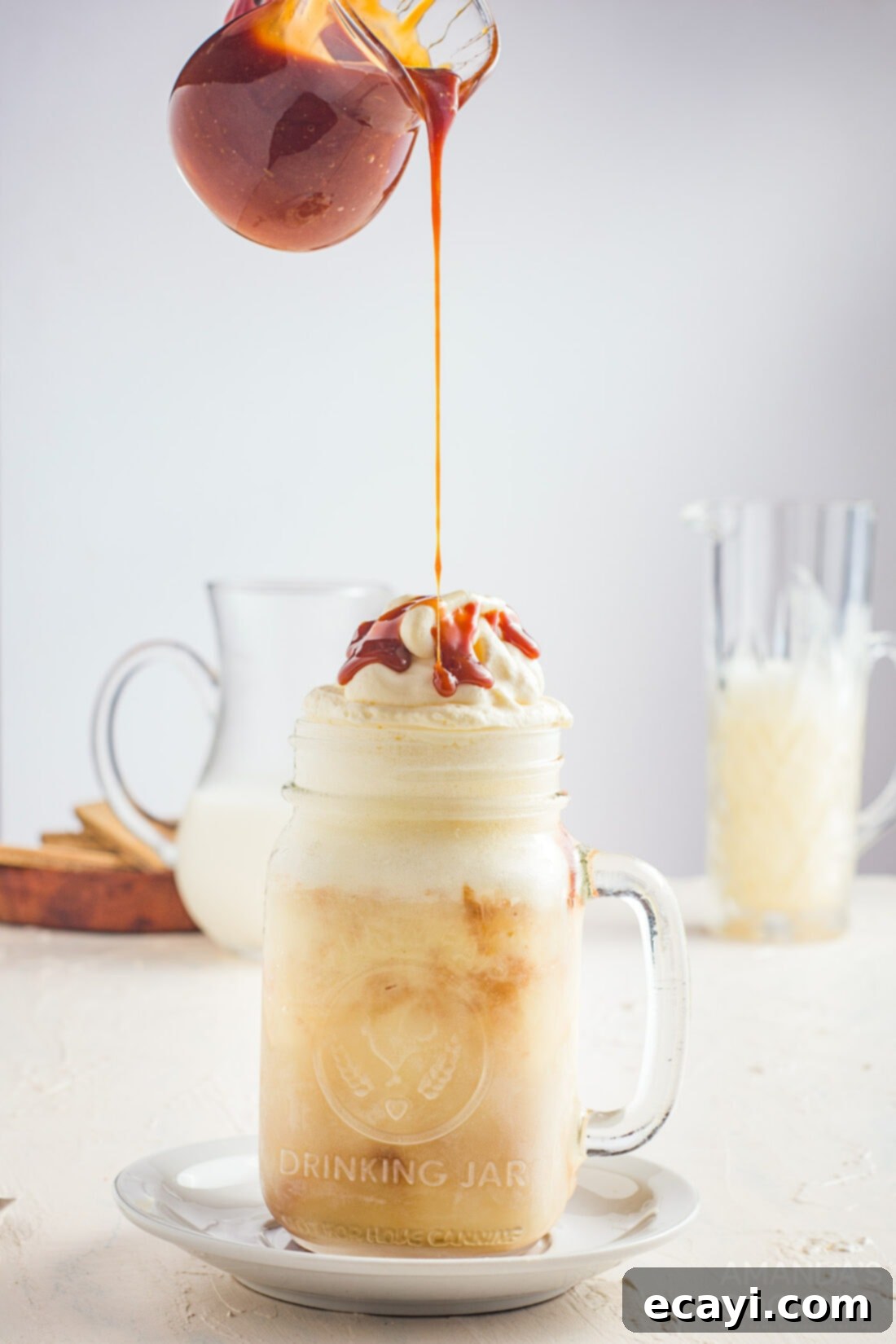 Decadent Salted Caramel Shake 3 drizzling caramel on top of milkshake