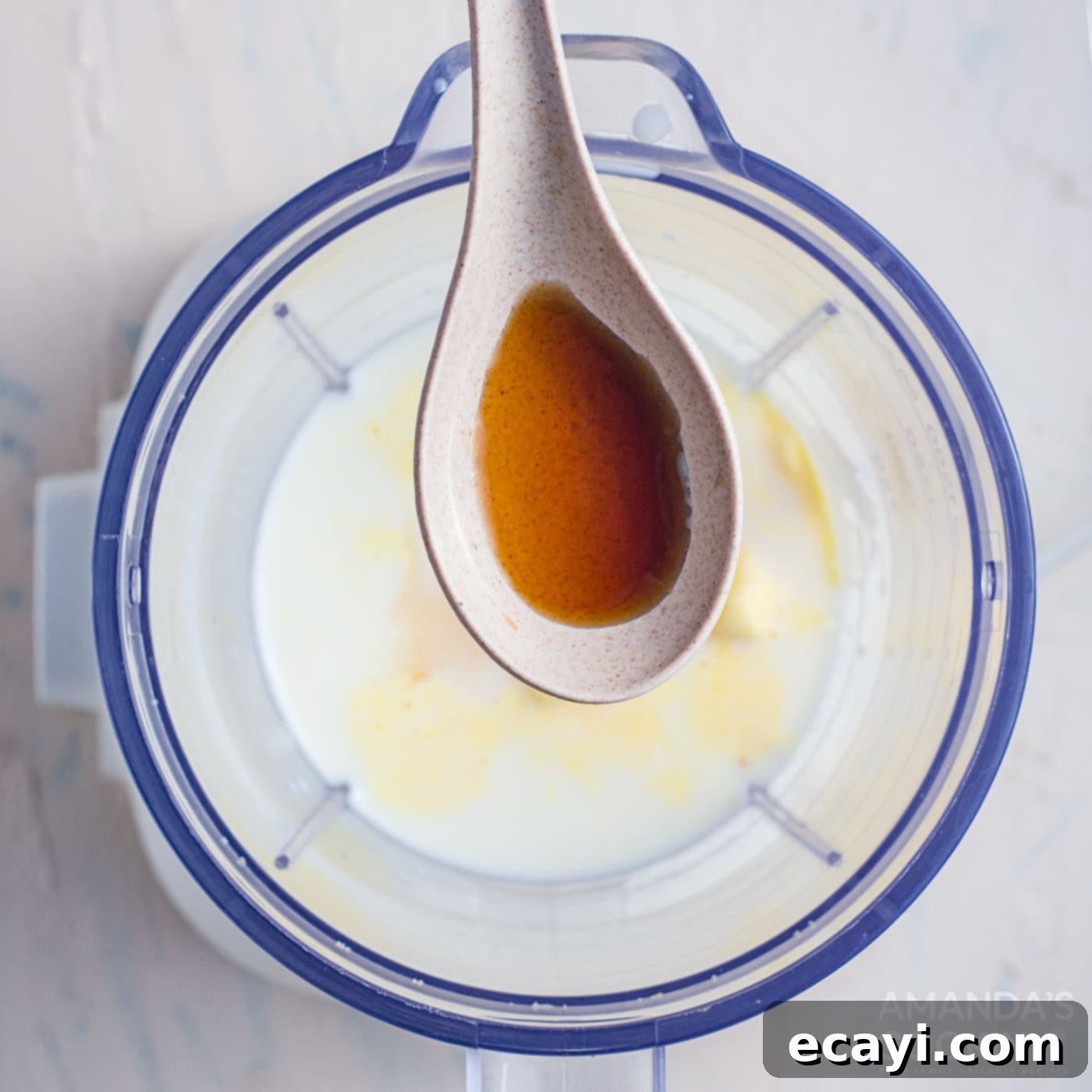 Decadent Salted Caramel Shake 5 salted caramel sauce in a spoon over blender