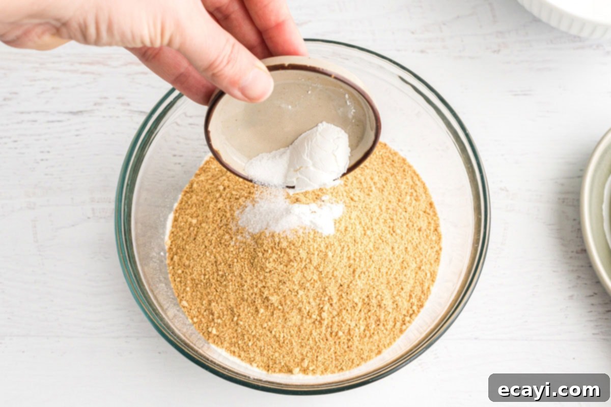 Ultimate Smores Bars 7 adding baking powder to graham crackers