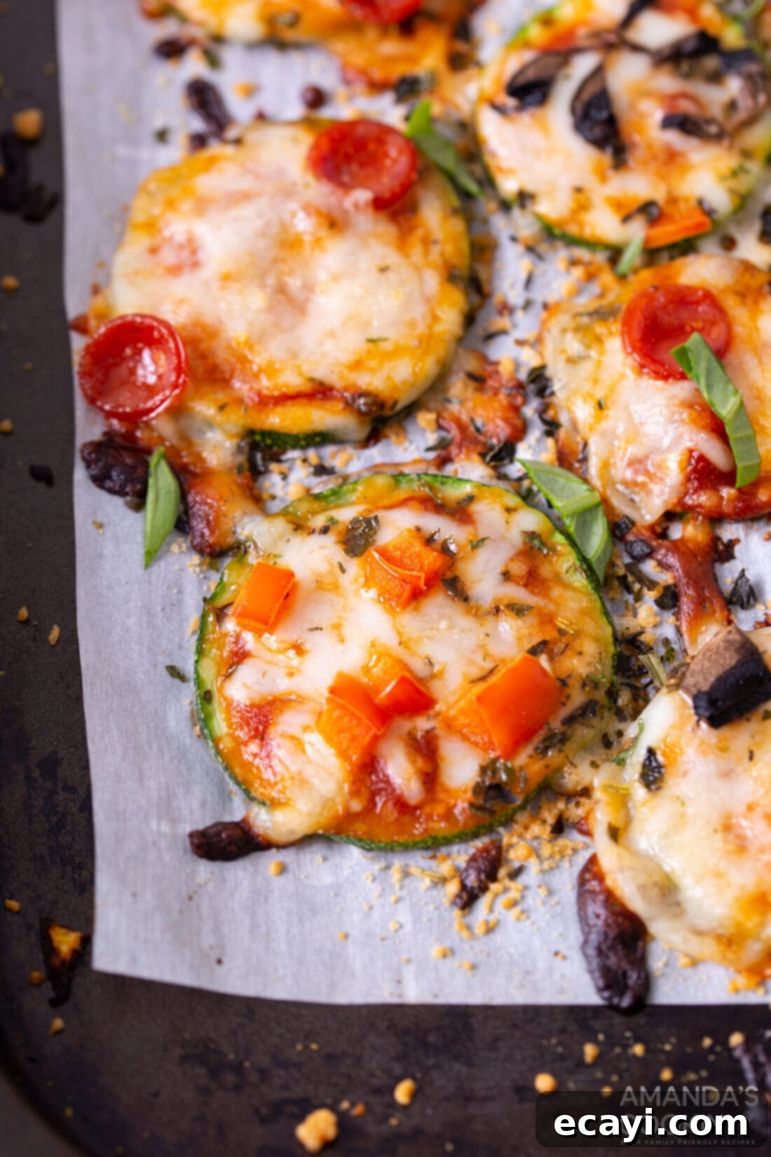 Zucchini Pizza Bites 2 Zucchini Pizza Bites on parchment
