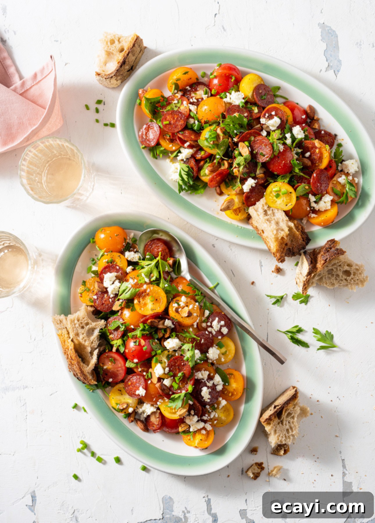 Vibrant Spanish Chorizo Tomato Salad with Toasted Almonds 4 Close-up of Spanish Tomato Salad with bright red tomatoes, chorizo, feta, and almonds.