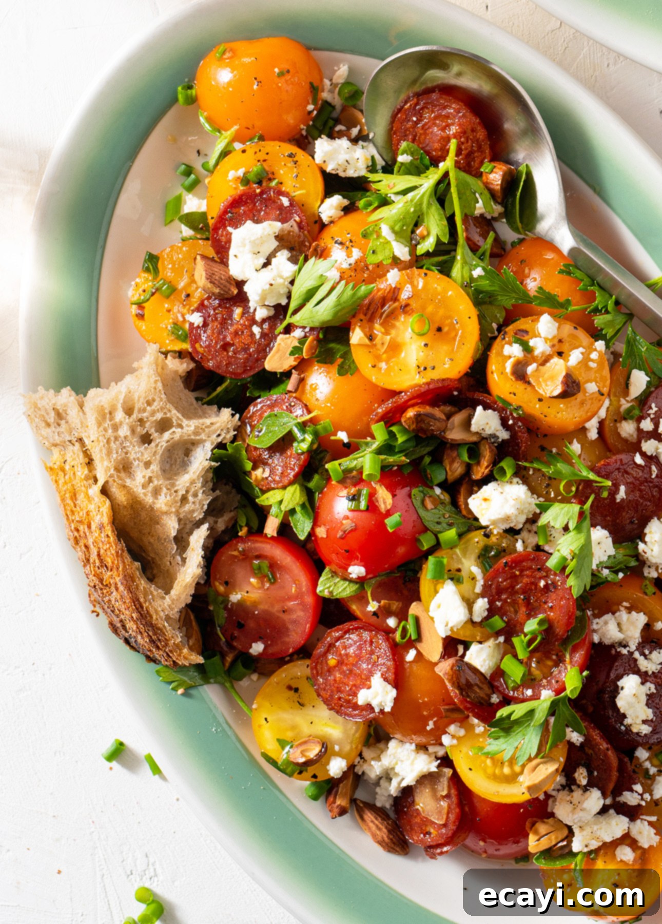 Vibrant Spanish Chorizo Tomato Salad with Toasted Almonds 5 Serving bowl of Spanish Tomato Salad, ready to be enjoyed.