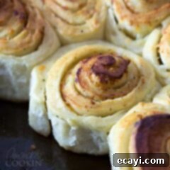 Mouthwatering Garlic Parmesan Rolls 10 A close up of Parmesan garlic rolls, baked to golden perfection.