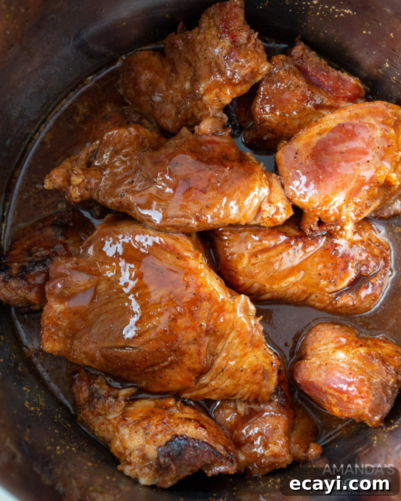 Perfectly Tender Instant Pot Pulled Pork 9 wet ingredients on top of pork shoulder in instant pot