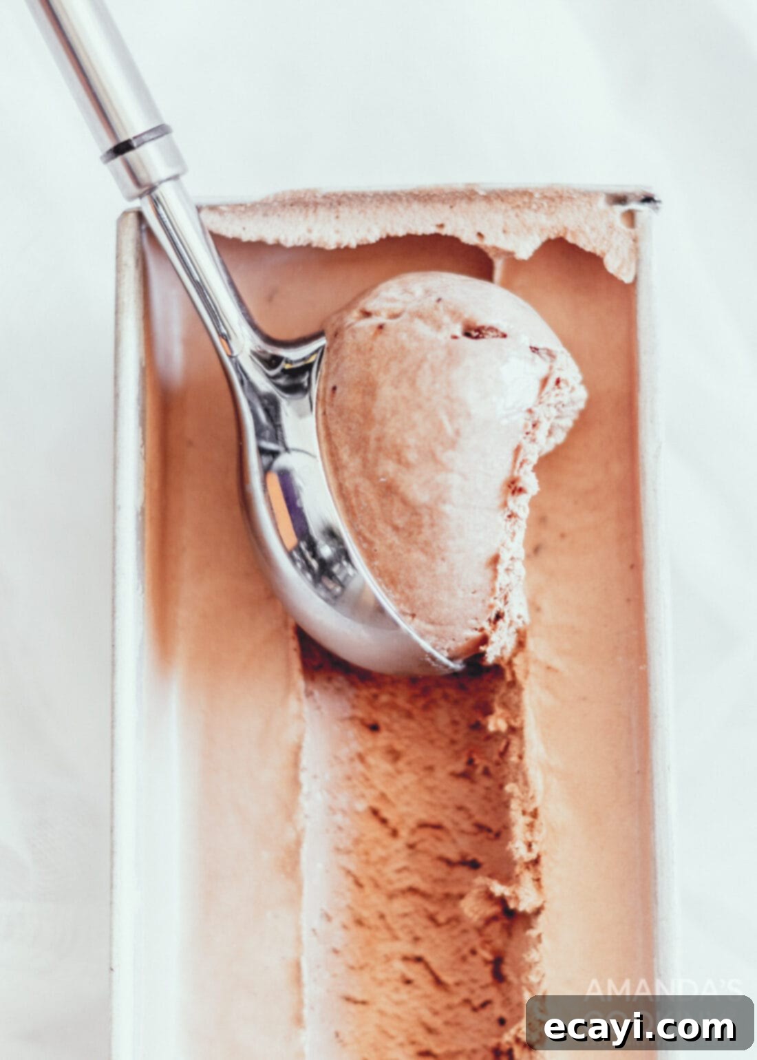 Decadent No-Churn Chocolate Ice Cream 2 scooping chocolate ice cream