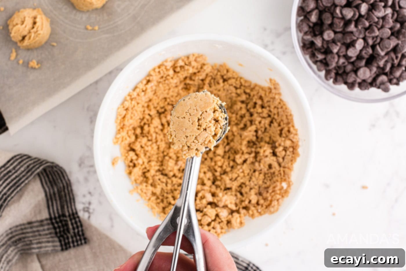 Peanut Butter Chocolate Delights 7 cookie scoop scooping peanut butter ball mixture