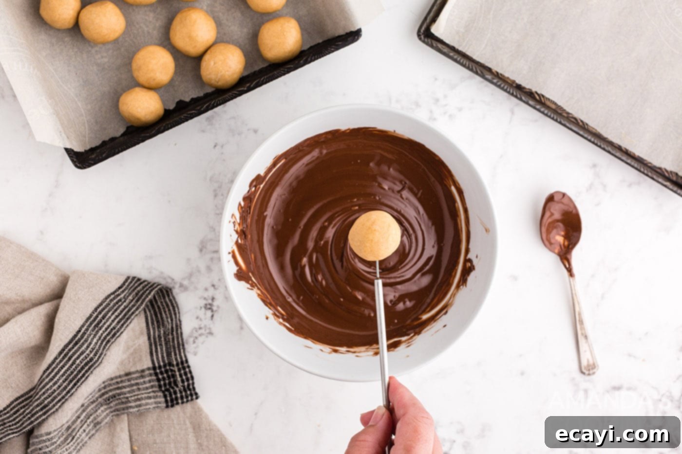 Peanut Butter Chocolate Delights 10 Dipping peanut butter ball into melted chocolate
