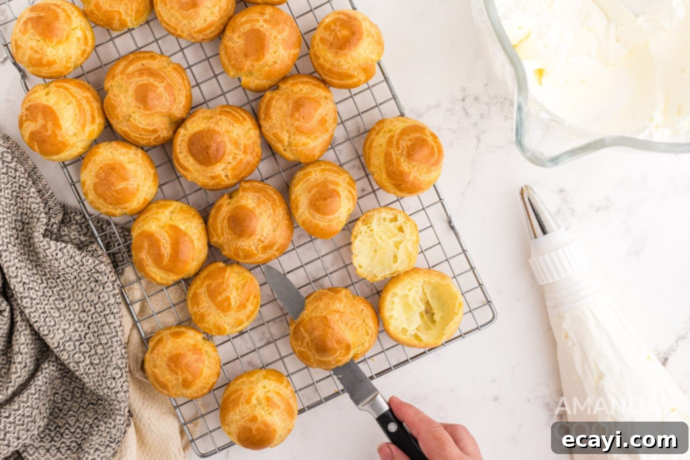 Golden Choux Delights 11 cream puffs on cooling rack